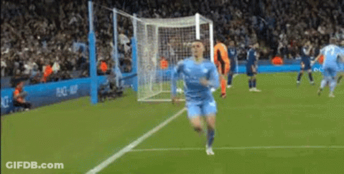 Man In Blue Shirt Standing On Soccer Field Eyes Closed GIF
