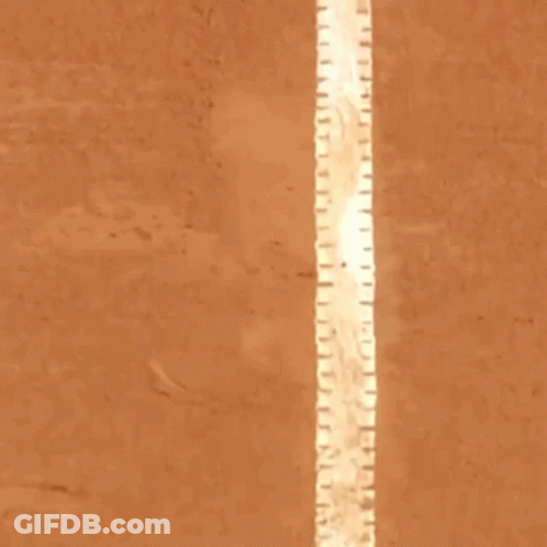 Man In Blue Shirt Standing On Tennis Court In Front Of Isdin Sign GIF