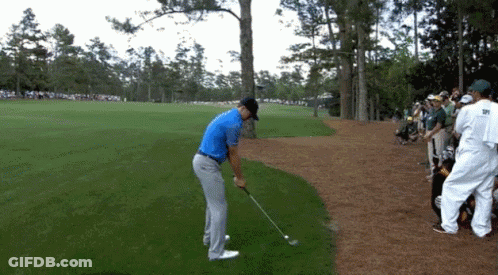Man In Blue Shirt Swinging Golf Club GIF