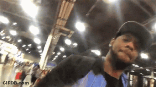 Man In Blue Shirt Taking Photo GIF