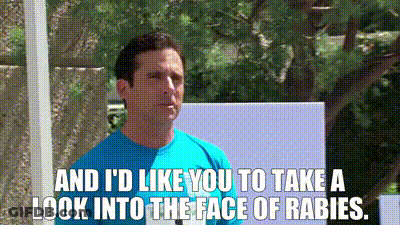 Man In Blue Shirt Talking About Rabies GIF