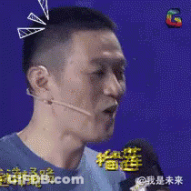 Man In Blue Shirt Talking Into Microphone With Headset GIF