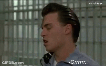 Man In Blue Shirt Talking On Phone GIF