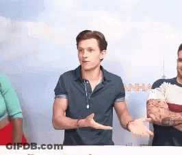 Man In Blue Shirt Talking To Group GIF