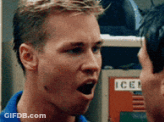 Man In Blue Shirt Talking To Man By Ice Locker GIF