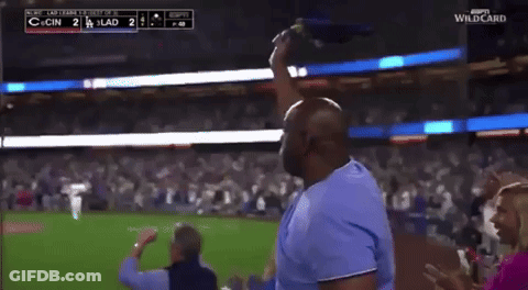 Man In Blue Shirt Throwing Flag At Baseball Game Score 2 To 1 GIF