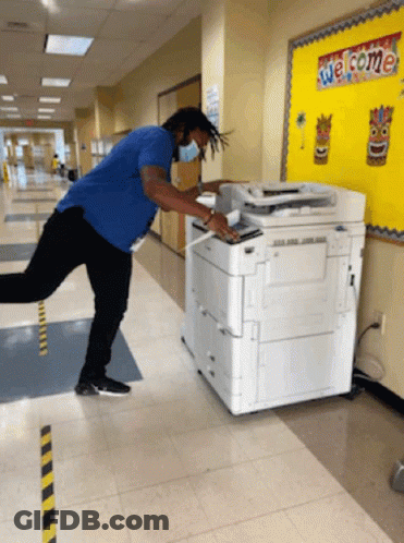 Man In Blue Shirt Using Copier GIF