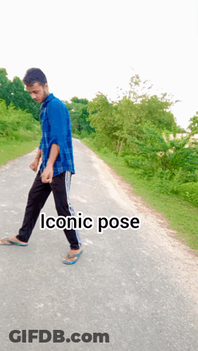 Man In Blue Shirt Walking Down Road Saying Iconic Pose GIF