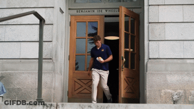 Man In Blue Shirt Walking Into Benjamin Ide Wheeler Building GIF