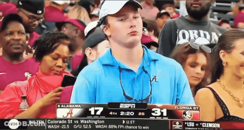 Man In Blue Shirt Watching Alabama Vs Washington GIF