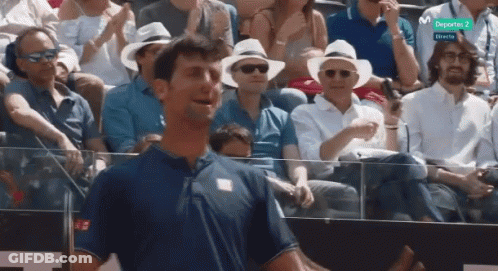 Man In Blue Shirt Watching Tennis Match GIF
