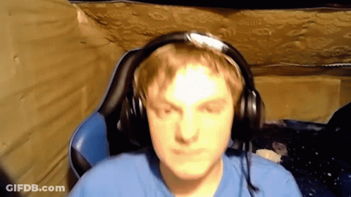 Man In Blue Shirt Wearing Headphones GIF