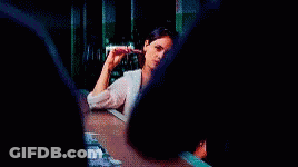 Man In Blue Shirt With Arms Crossed In Front Of Acer Monitor GIF