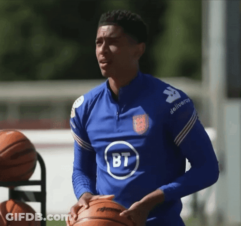 Man In Blue Shirt With BT Holding Basketball GIF