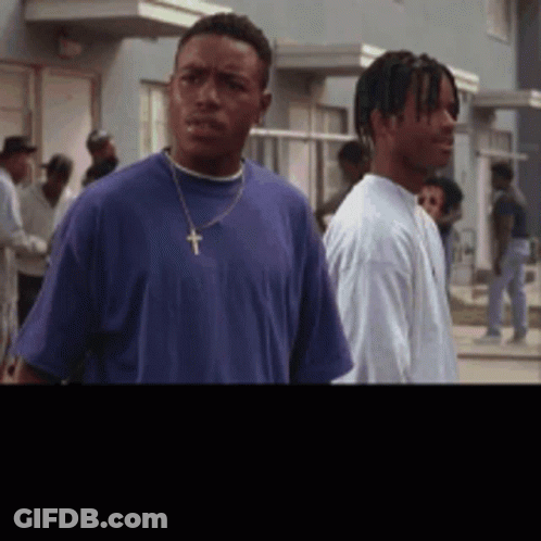 Man In Blue Shirt With Cross GIF