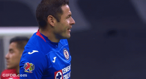 Man In Blue Shirt With Cross GIF