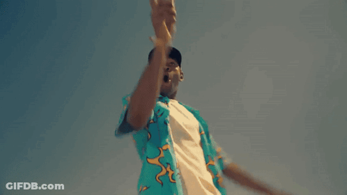 Man In Blue Shirt With Flamingos Dancing In Desert GIF