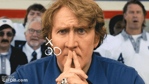 Man In Blue Shirt With Football Players In C Jerseys GIF