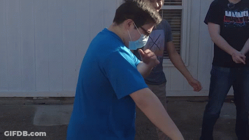 Man In Blue Shirt With Foundation Laying On Ground GIF