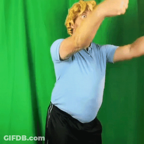 Man In Blue Shirt With Green Background GIF