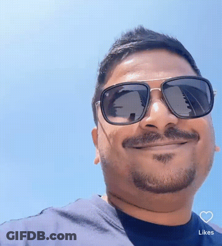 Man In Blue Shirt With Heart GIF