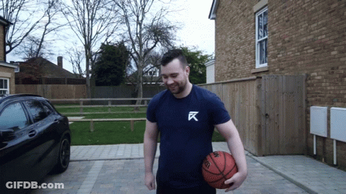 Man In Blue Shirt With Letter K GIF