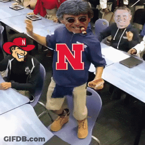 Man In Blue Shirt With Letter N GIF