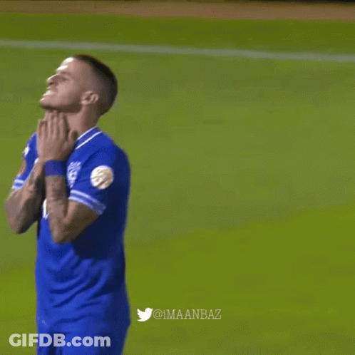 Man In Blue Shirt With Letter V GIF