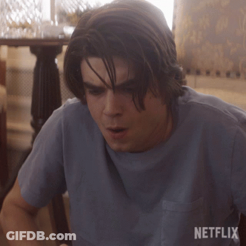 Man In Blue Shirt With Netflix Logo GIF