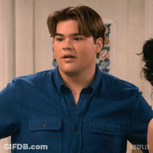Man In Blue Shirt With Netflix Logo GIF