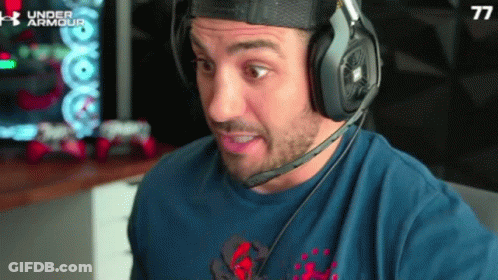 Man In Blue Shirt With Number 77 And Headphones GIF