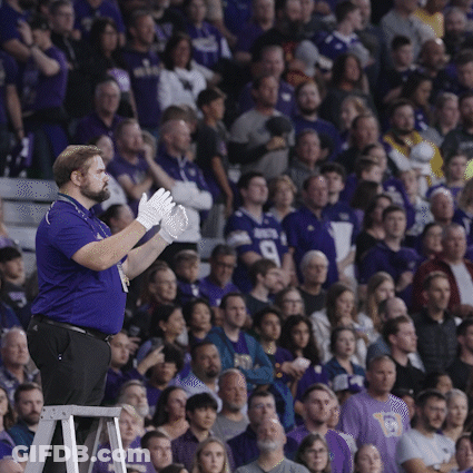 Man In Blue Shirt With Number 9 In Front Of Crowd GIF