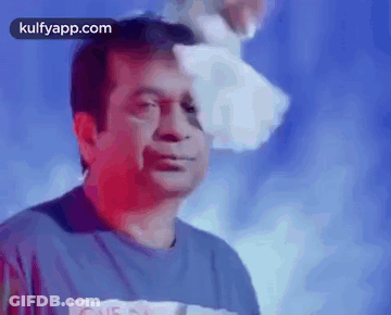Man In Blue Shirt With Paper On Head GIF