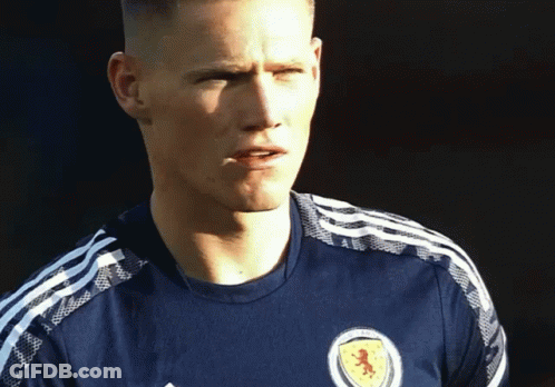 Man In Blue Shirt With Red Lion GIF