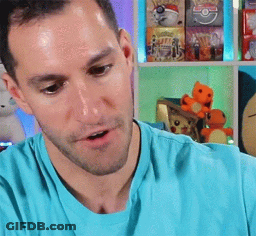 Man In Blue Shirt With Shelf Of Pokemon Toys GIF