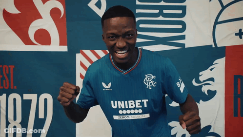 Man In Blue Shirt With Unibet On Sleeve GIF
