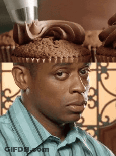 Man In Blue Striped Shirt Looking At Cupcake On Head GIF