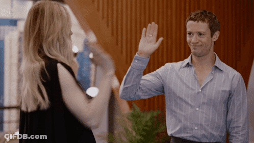 Man In Blue Striped Shirt Waving At Woman In Black Dress GIF
