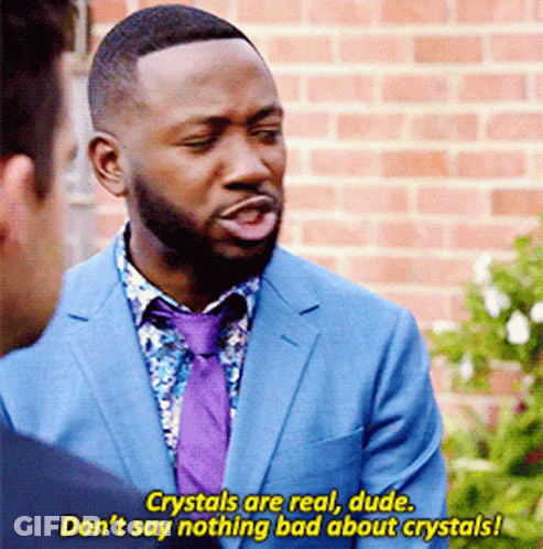 Man In Blue Suit And Purple Tie Talking To Another Man GIF