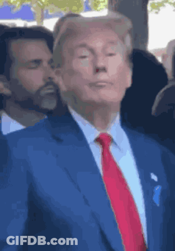 Man In Blue Suit And Red Tie GIF