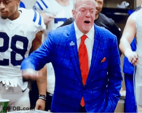 Man In Blue Suit And Red Tie With Football Player 28 GIF