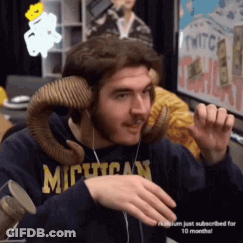 Man In Blue Suit And Tie In Front Of MTV Logo GIF