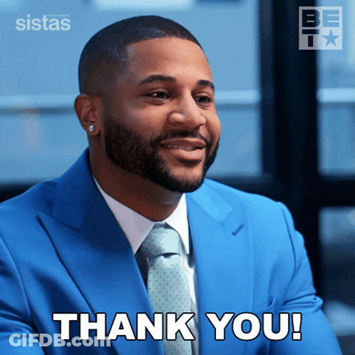Man In Blue Suit And Tie Says Thank You GIF