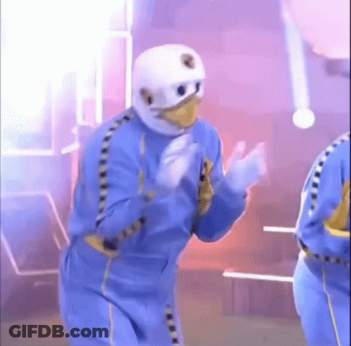 Man In Blue Suit And White Helmet Dancing GIF