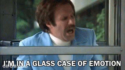 Man In Blue Suit And White Turtleneck Screaming By Window GIF