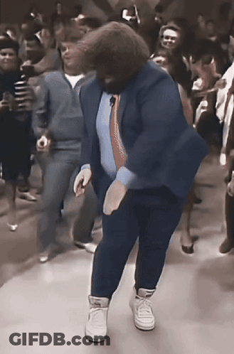 Man In Blue Suit Dancing In Front Of Crowd GIF