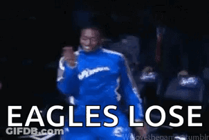 Man In Blue Suit Dancing With Eagles Lose GIF