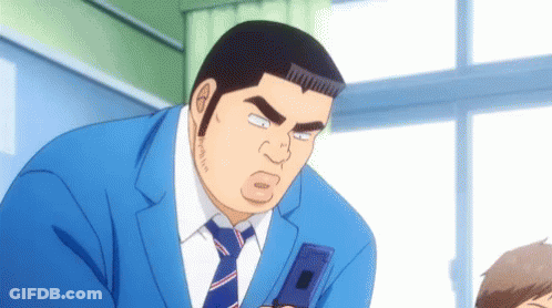 Man In Blue Suit Holding Cell Phone GIF