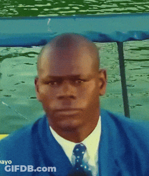 Man In Blue Suit Looking At Camera Saying Ayo GIF