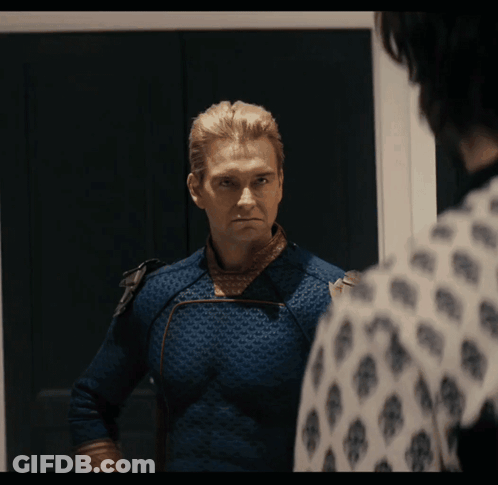 Man In Blue Suit Looking In Mirror GIF